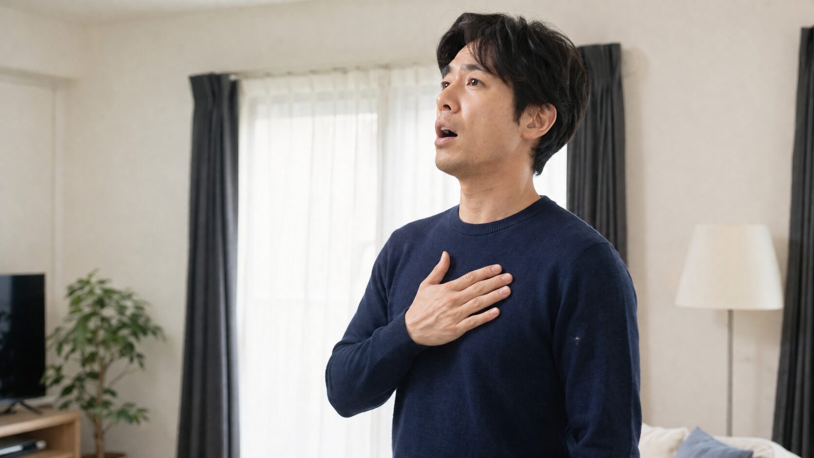 音域を広げる練習に集中する30代男性の発声シーン